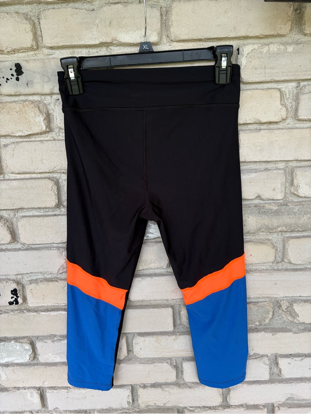 Women Under Armour Black Active Capri Leggings with Blue and Orange Accents